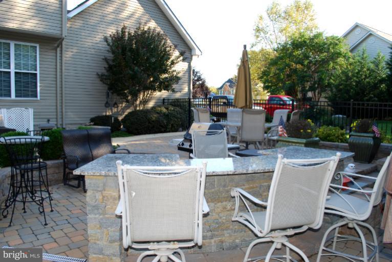 607 Havenhill Road Edgewater, MD 21037 - Photo 15 of 29 a view of table and chairs in patio