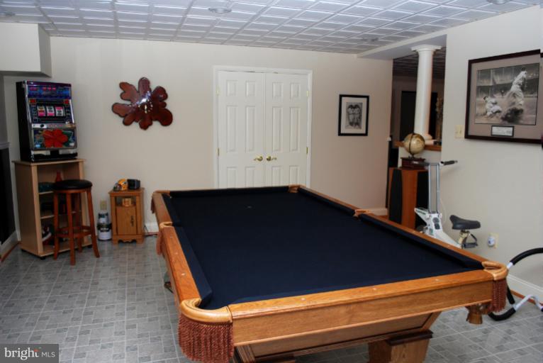 607 Havenhill Road Edgewater, MD 21037 - Photo 25 of 29 a blue bed sitting in a bedroom next to a window