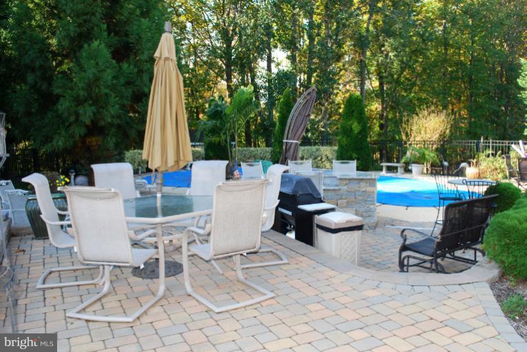 607 Havenhill Road Edgewater, MD 21037 - Photo 7 of 29 a view of a patio with a dining table and chairs