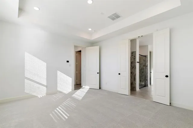 a view of a livingroom with bathroom and shower