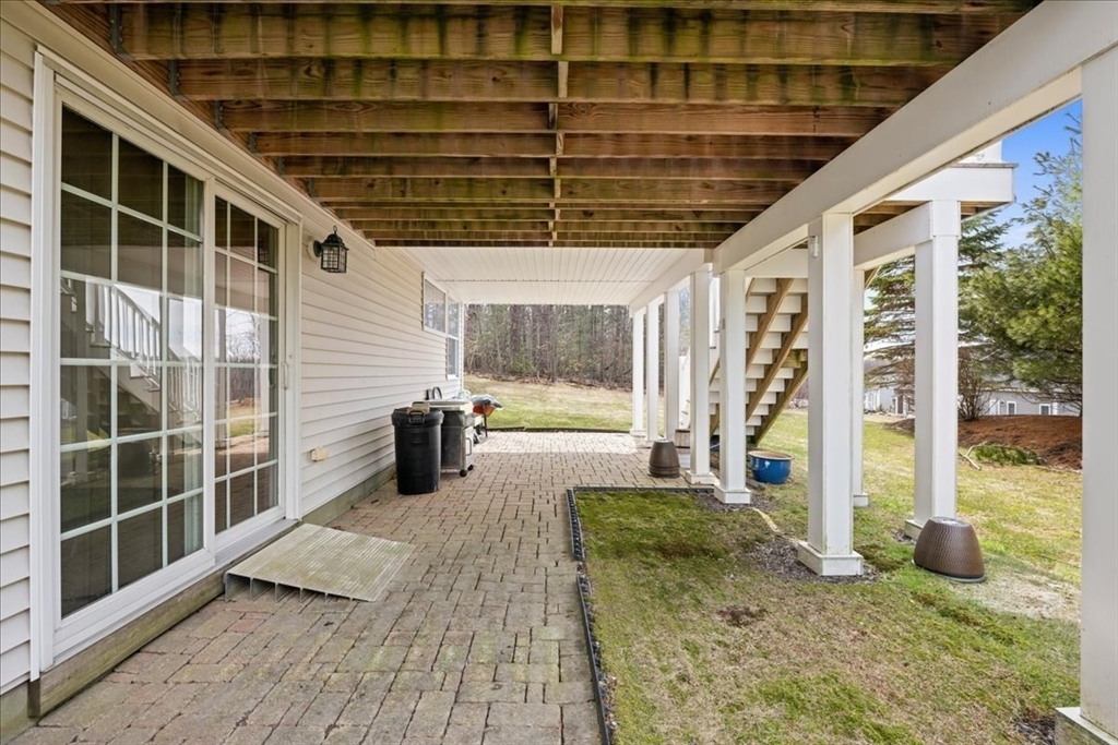 7 Primmett Lane, Unit 7 Worcester, MA 01609 - Photo 36 of 38 a view of a porch with wooden floor and windows