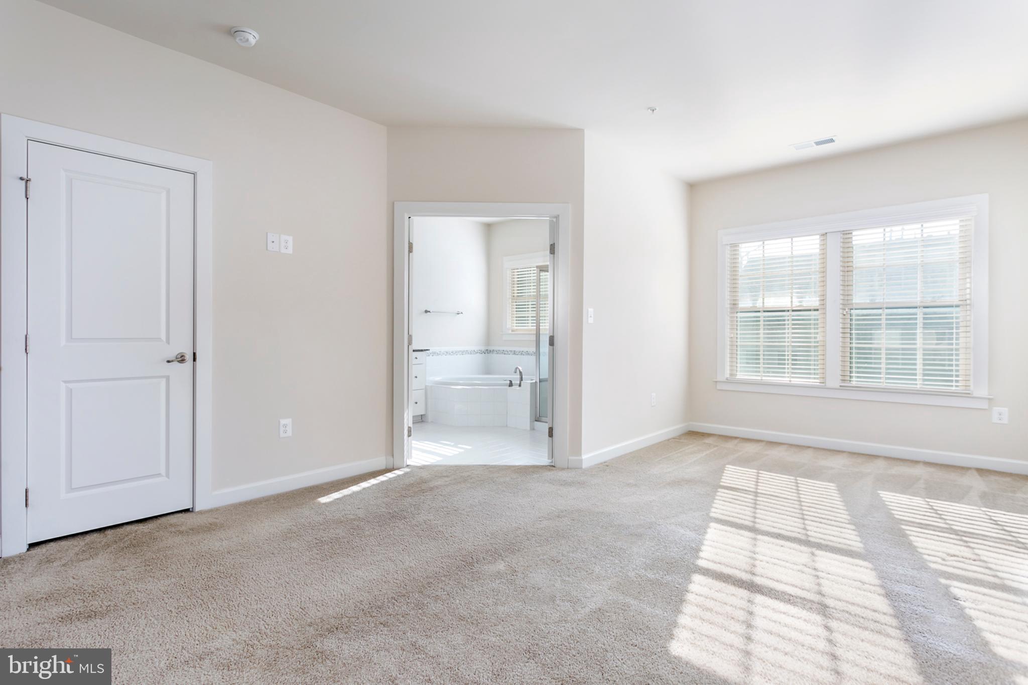 7812 Patterson Way Hanover, MD 21076 - Photo 9 of 15 a view of an empty room with a window
