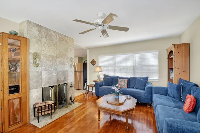 a kitchen with white cabinets appliances and a sink