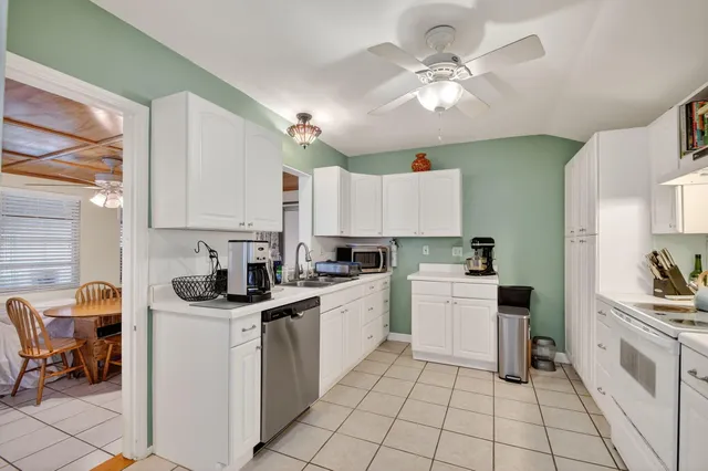 a bed room with a bed and a television