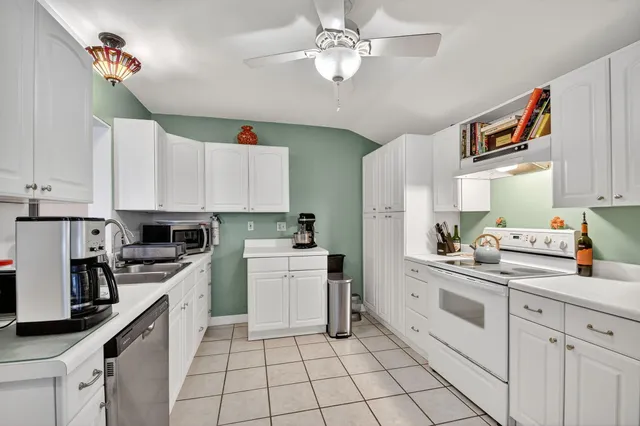 a bedroom with a bed and wooden closet