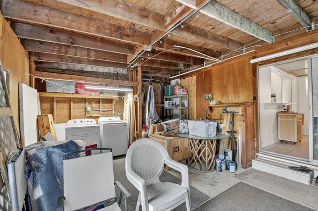 an aerial view of residential houses with outdoor space and swimming pool