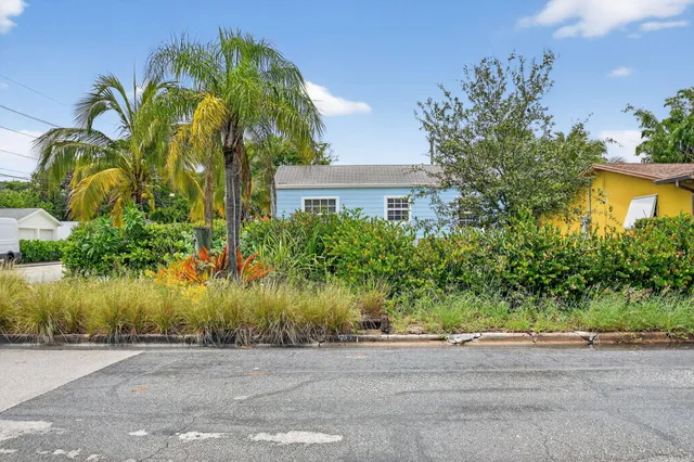 a view of living room with furniture and wooden floor