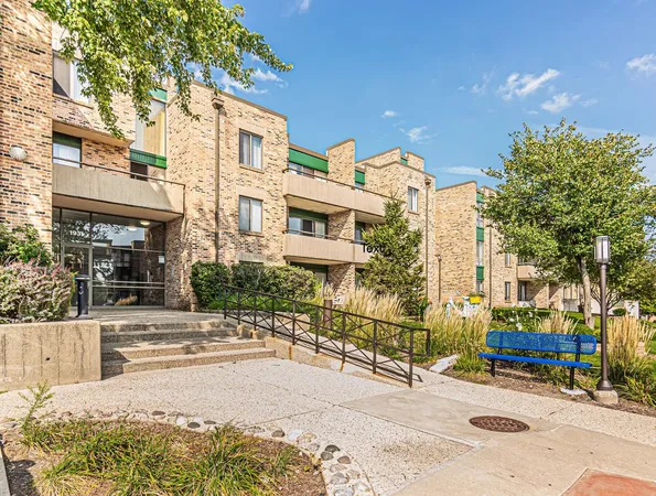 a view of a brick building next to a road