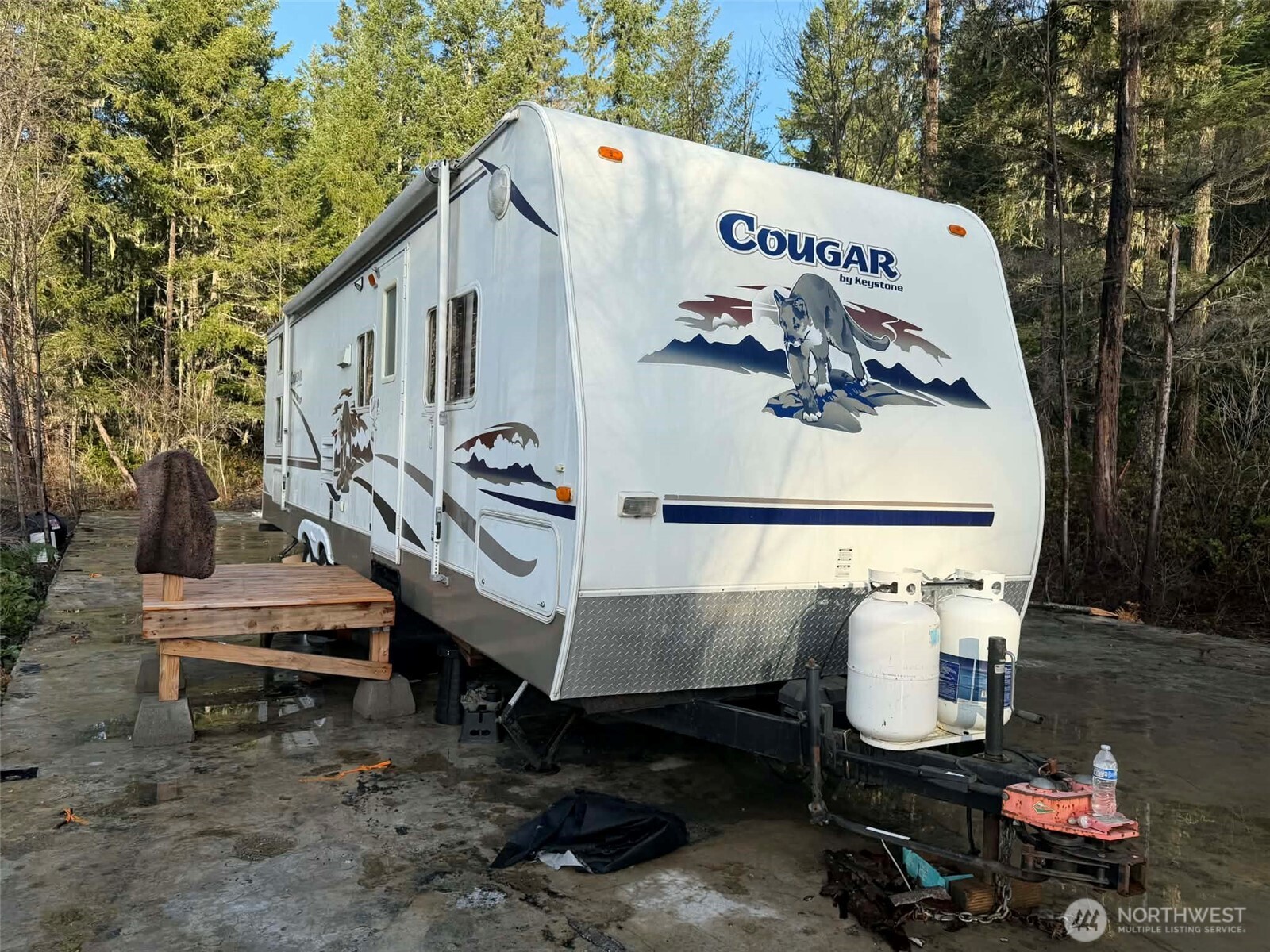 3791 Northeast Sand Hill Road Belfair, WA 98528 - Photo 12 of 13 a front view of a house with garden