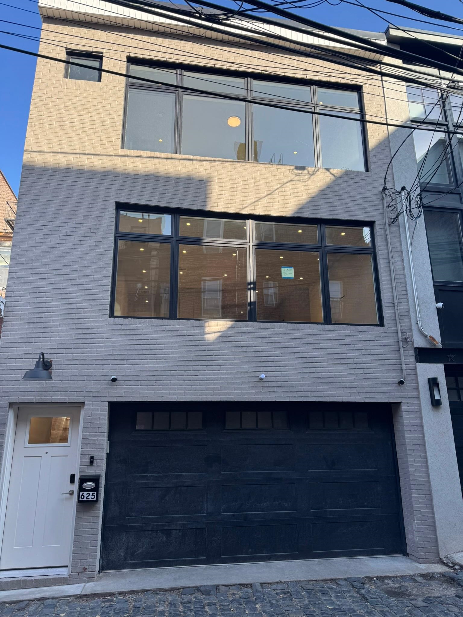 625 Court Street Hoboken, NJ 07030 - Photo 1 of 14 a front view of a house with windows