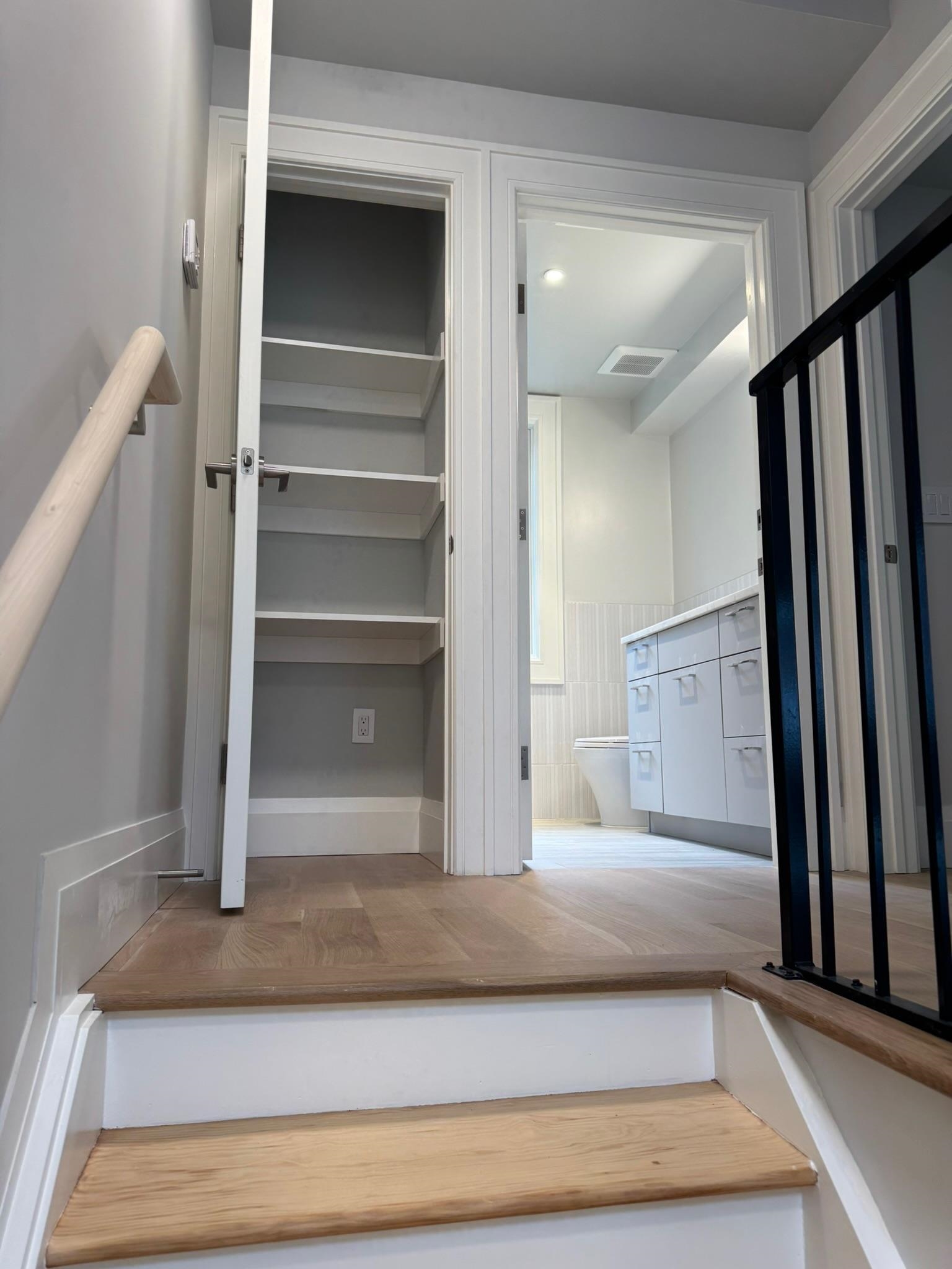 625 Court Street Hoboken, NJ 07030 - Photo 5 of 14 a living room with a bed and a mirror