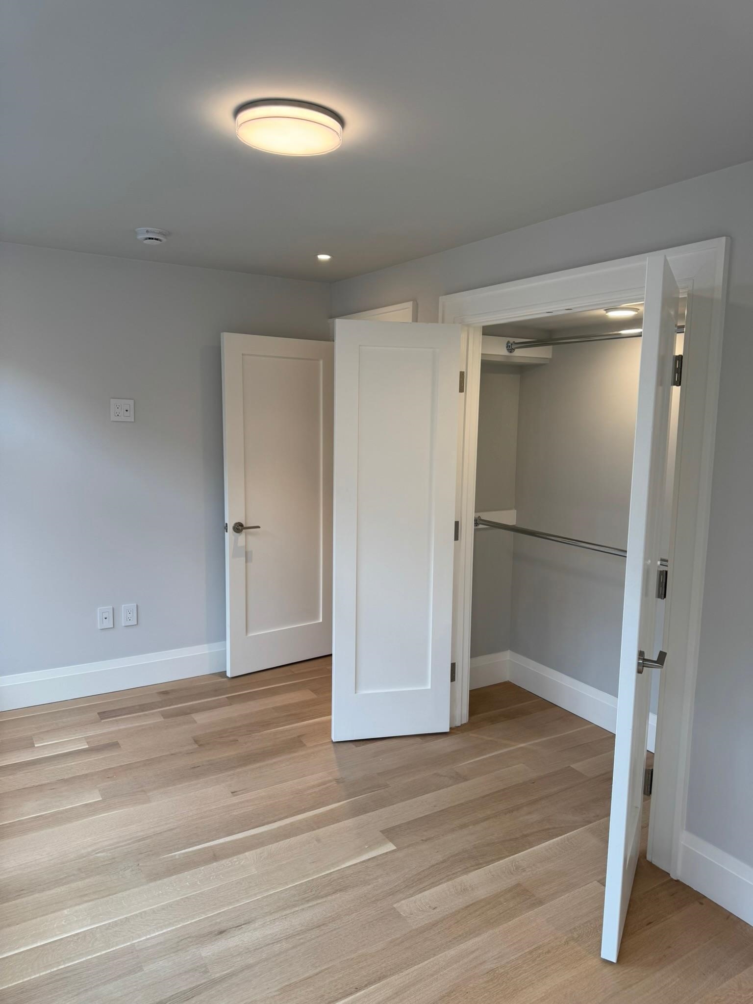 625 Court Street Hoboken, NJ 07030 - Photo 6 of 14 a view of an empty room with wooden floor closet and windows