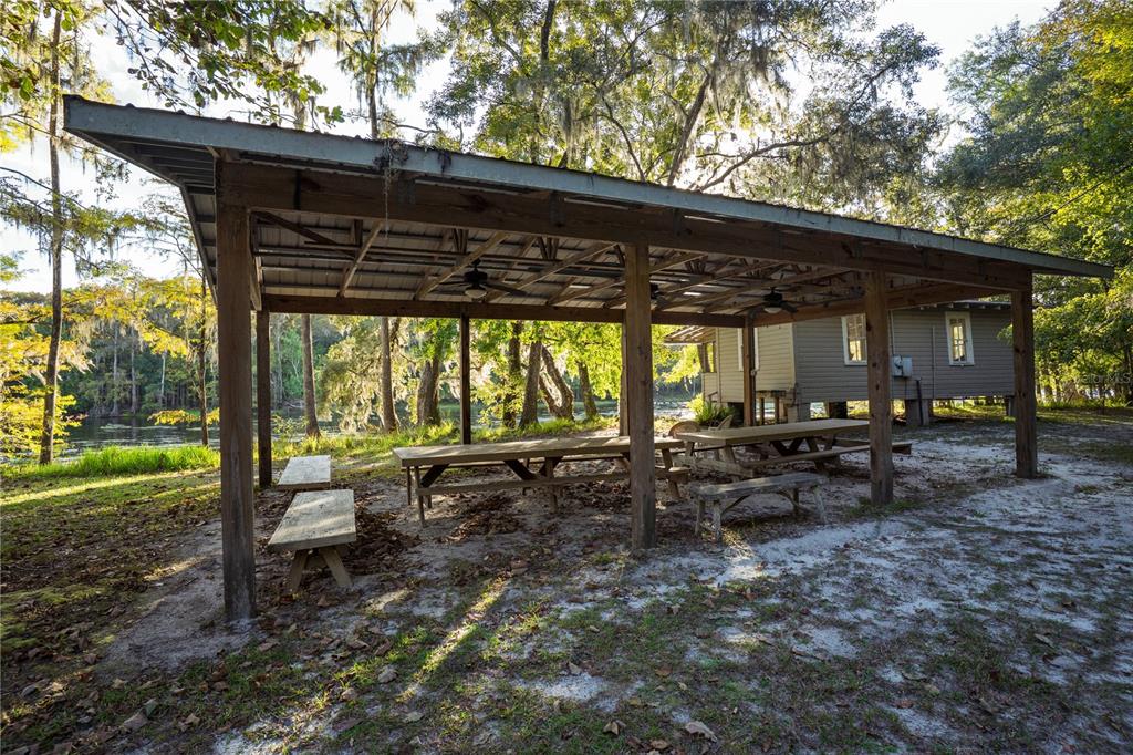 Blue Bird Court Southwest Fort White, FL 32038 - Photo 7 of 15 a view of a patio with a table chairs and a backyard