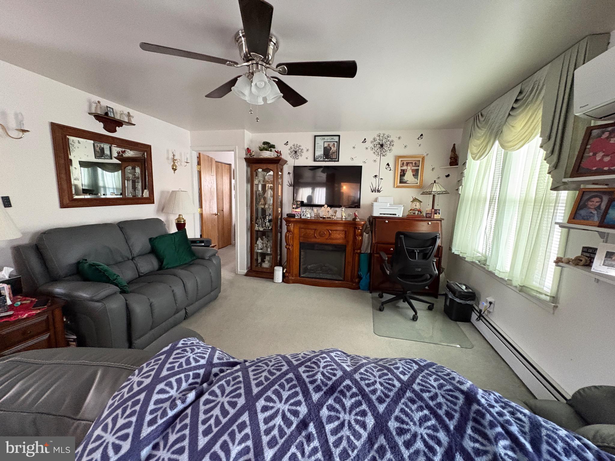 15 South Forklanding Road Maple Shade, NJ 08052 - Photo 6 of 30 a living room with furniture ceiling fan and a window