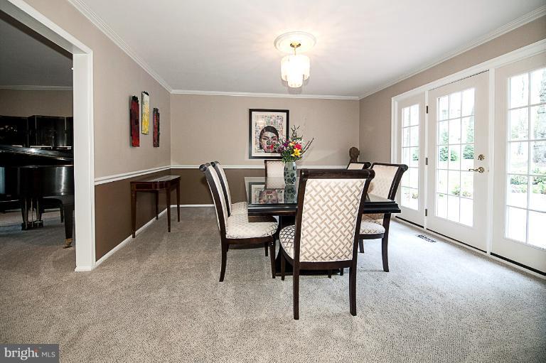 10101 Counselman Road Potomac, MD 20854 - Photo 22 of 30 a view of a dining room with furniture and a window