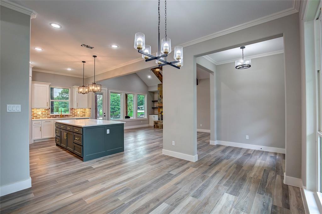 405 Door Key Ranch Road Trinidad, TX 75163 - Photo 12 of 28 Kitchen featuring a kitchen island, white cabinetry, light hardwood / wood-style floors, and decorative light fixtures