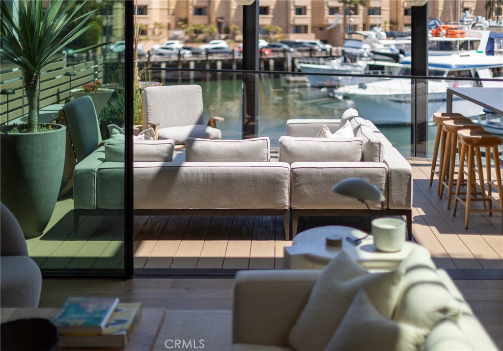 2910 Lafayette Avenue Newport Beach, CA 92663 - Photo 18 of 60 a balcony with furniture and view of lake