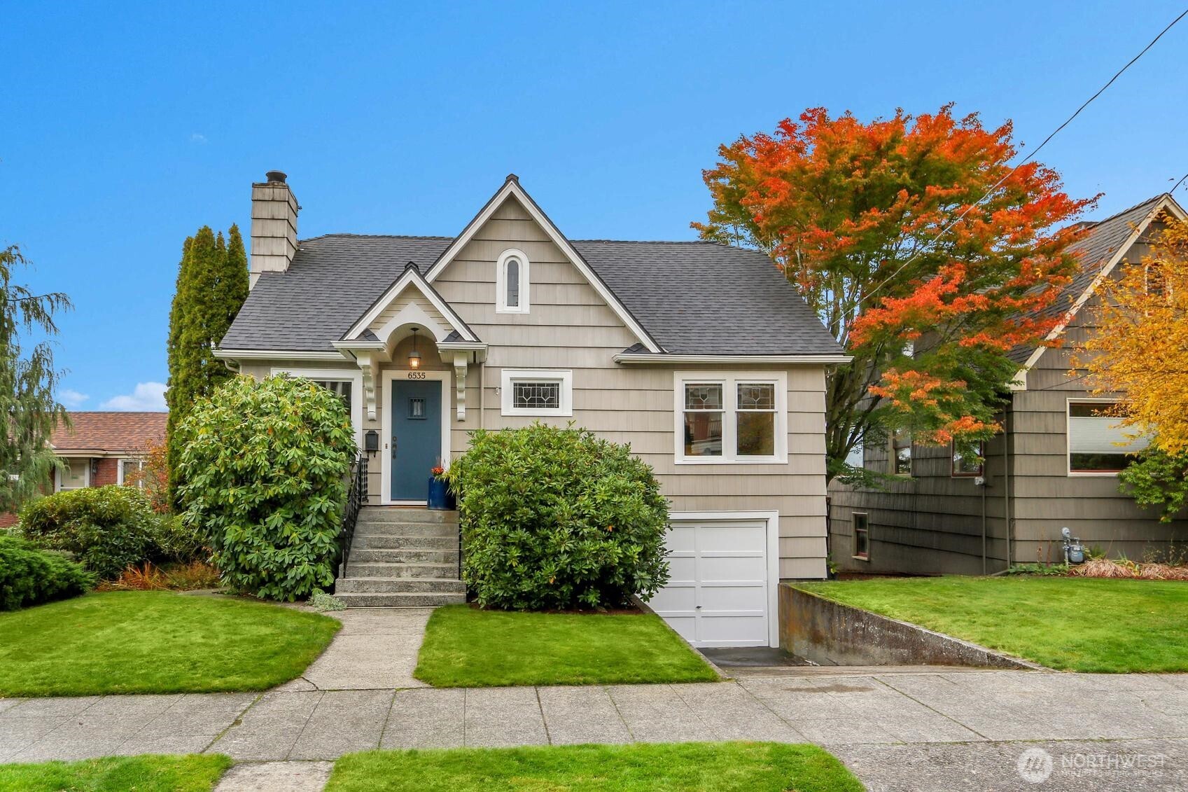 6535 Sycamore Avenue Northwest Seattle, WA 98117 - Photo 1 of 23 a front view of house with yard and green space