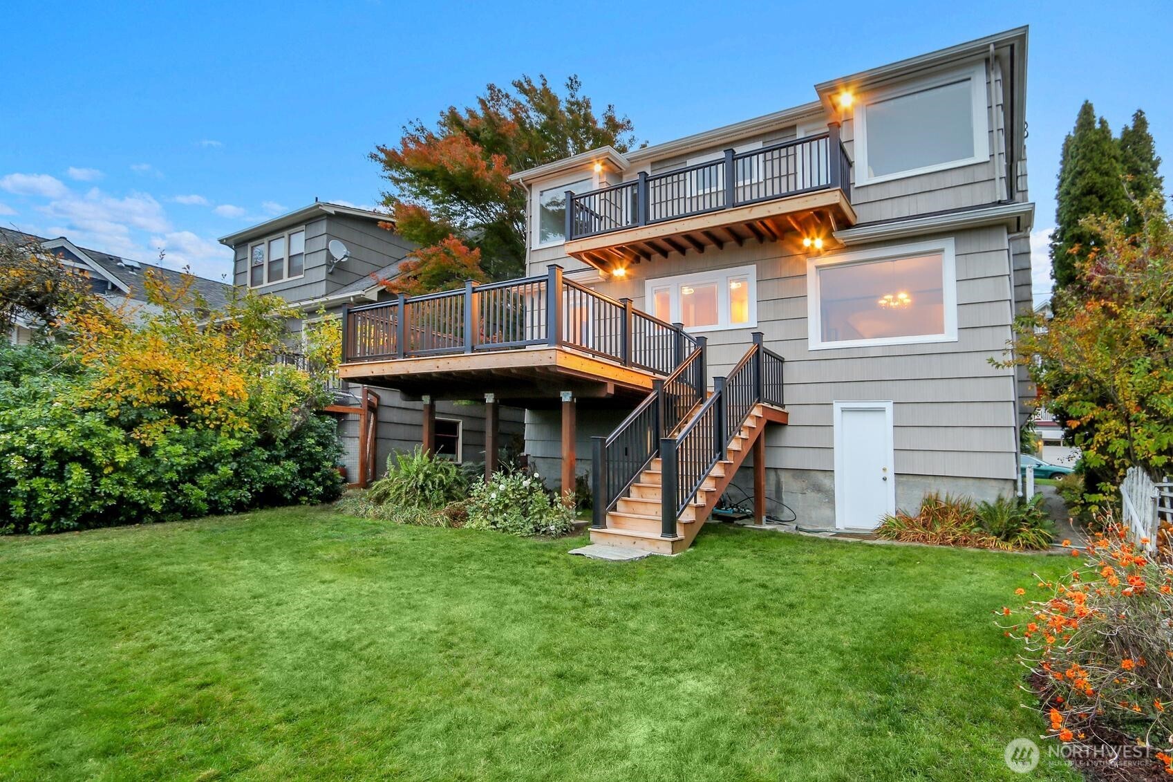 6535 Sycamore Avenue Northwest Seattle, WA 98117 - Photo 18 of 23 a view of a house with a big yard and potted plants