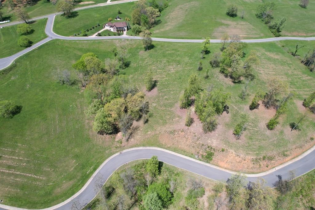 2069 Edgewater Sound Morristown, TN 37814 - Photo 8 of 17 a view of a swimming pool with a yard