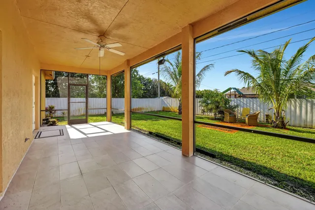 a view of swimming pool with a garden and trees