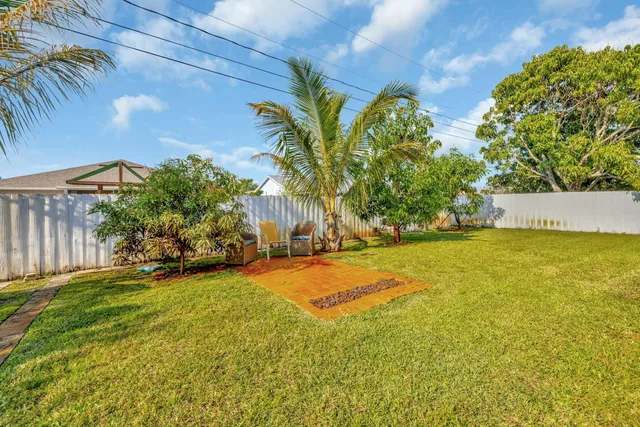 a view of a yard with swimming pool