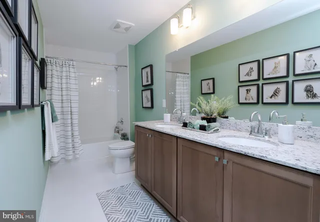 a living room with furniture and flowers