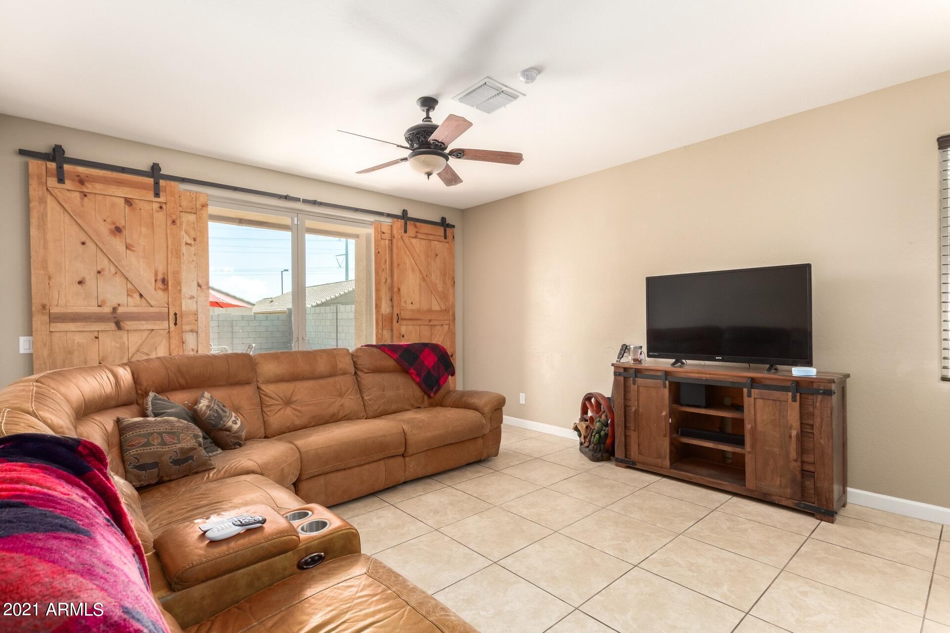 23849 West Ripple Road Buckeye, AZ 85326 - Photo 13 of 27 Living Room with custom barn doors