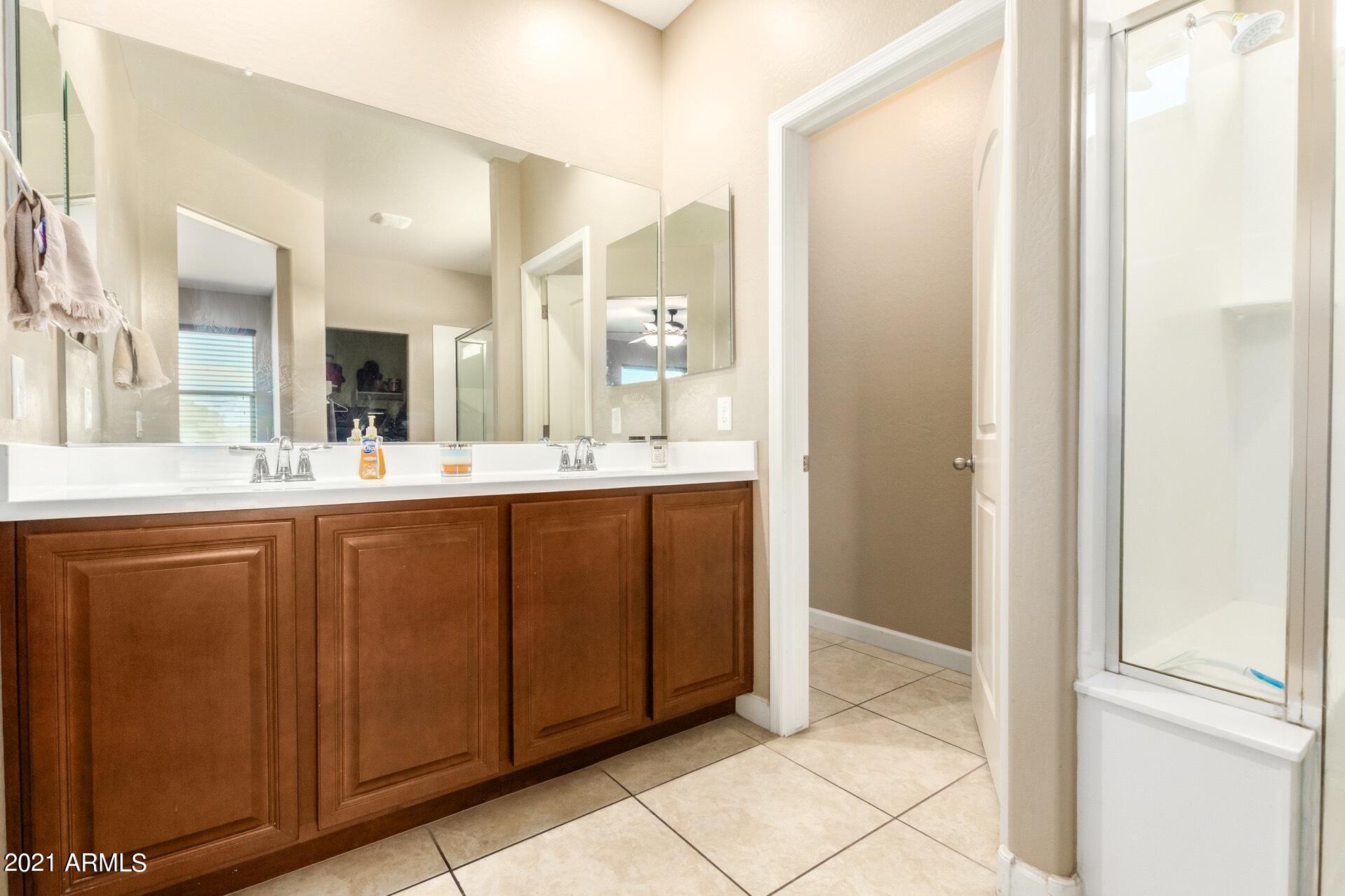 23849 West Ripple Road Buckeye, AZ 85326 - Photo 22 of 27 Primary en-suite