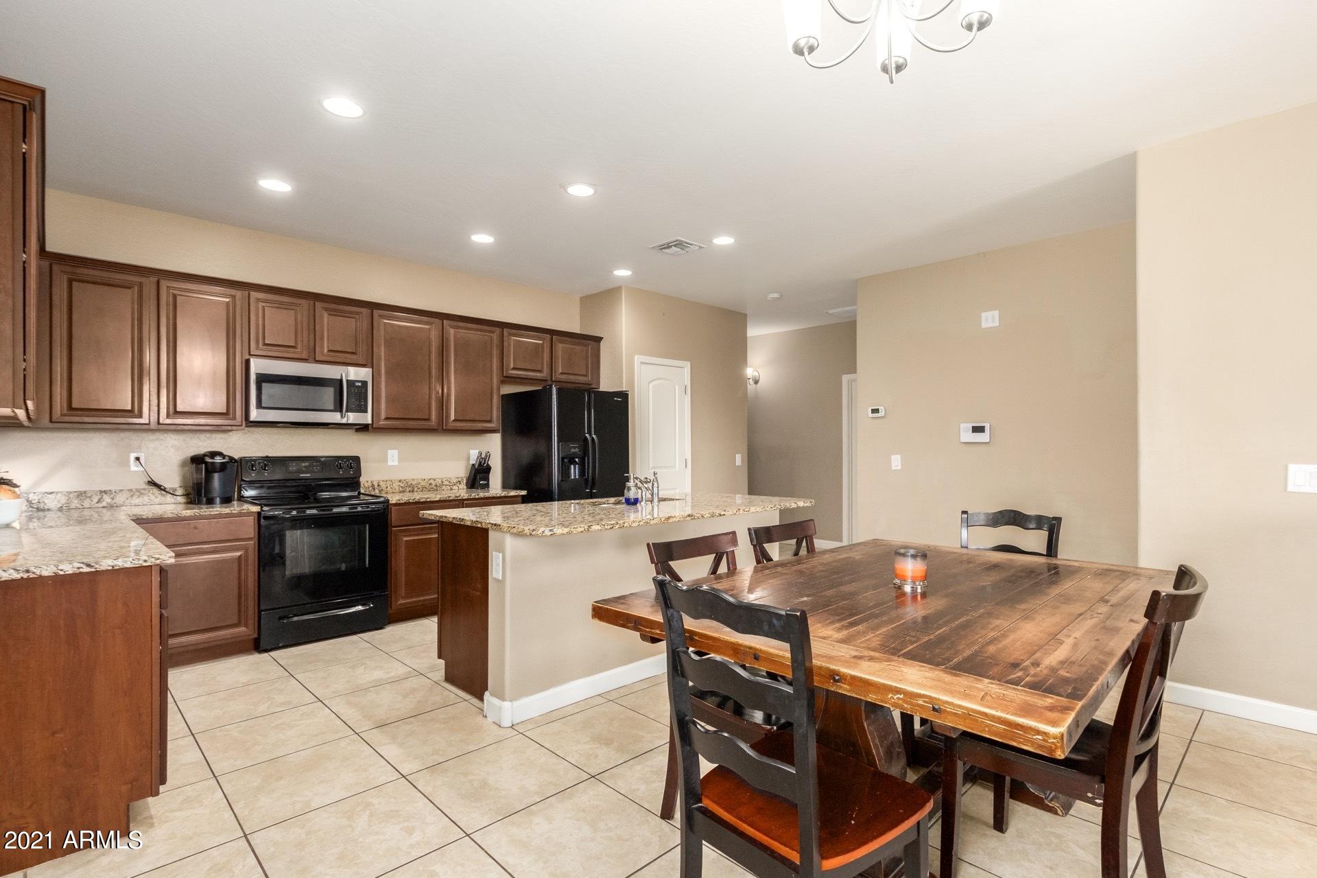 23849 West Ripple Road Buckeye, AZ 85326 - Photo 8 of 27 Kitchen and eating area