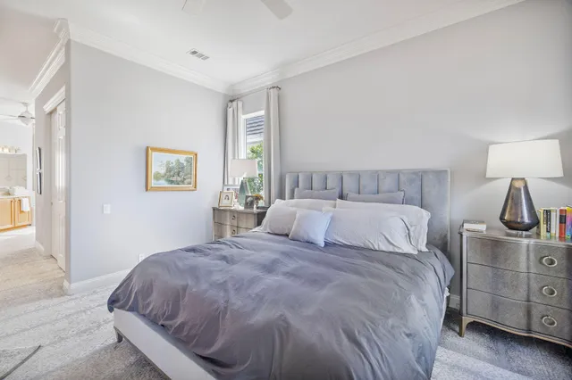a spacious bathroom with a granite countertop sink a mirror a bathtub and shower