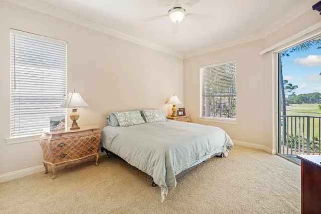 a view of a livingroom with a ceiling fan and window