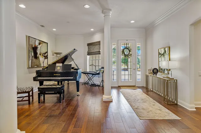 a view of a dining room with furniture window and wooden floor