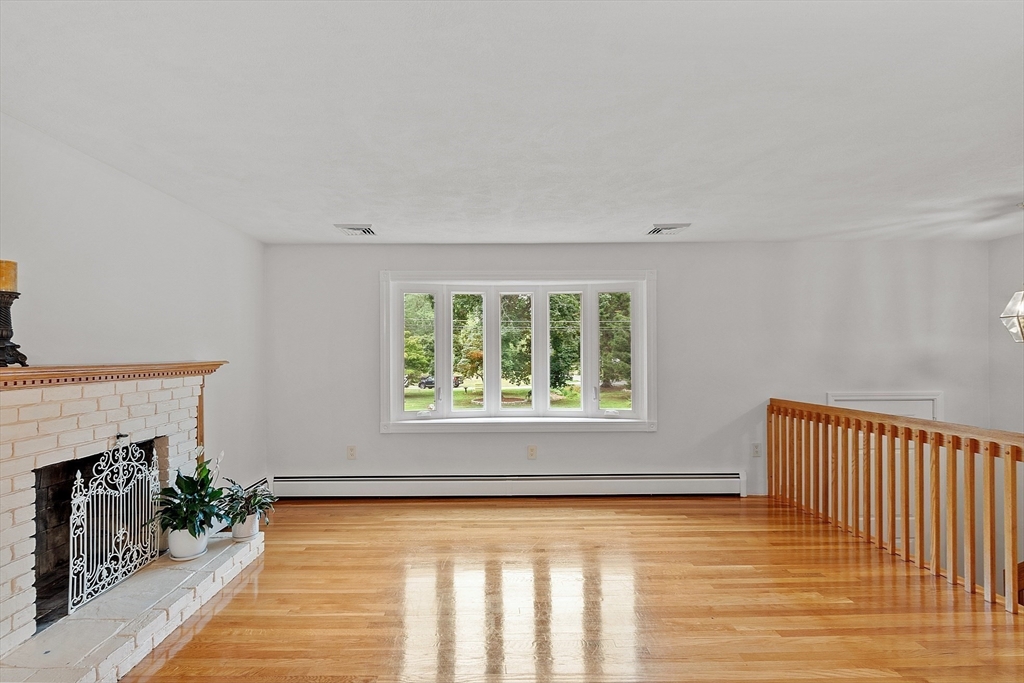 2 Johnson Road Chelmsford, MA 01824 - Photo 15 of 42 a view of an empty room with wooden floor and a window