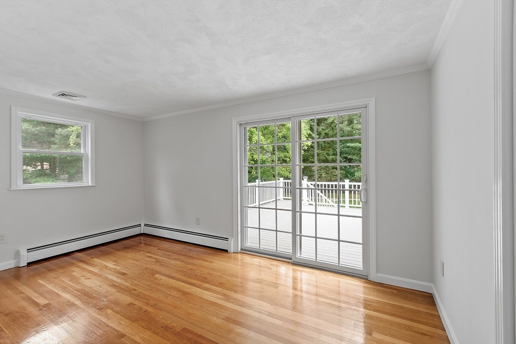 2 Johnson Road Chelmsford, MA 01824 - Photo 17 of 42 a view of an empty room with wooden floor and a window