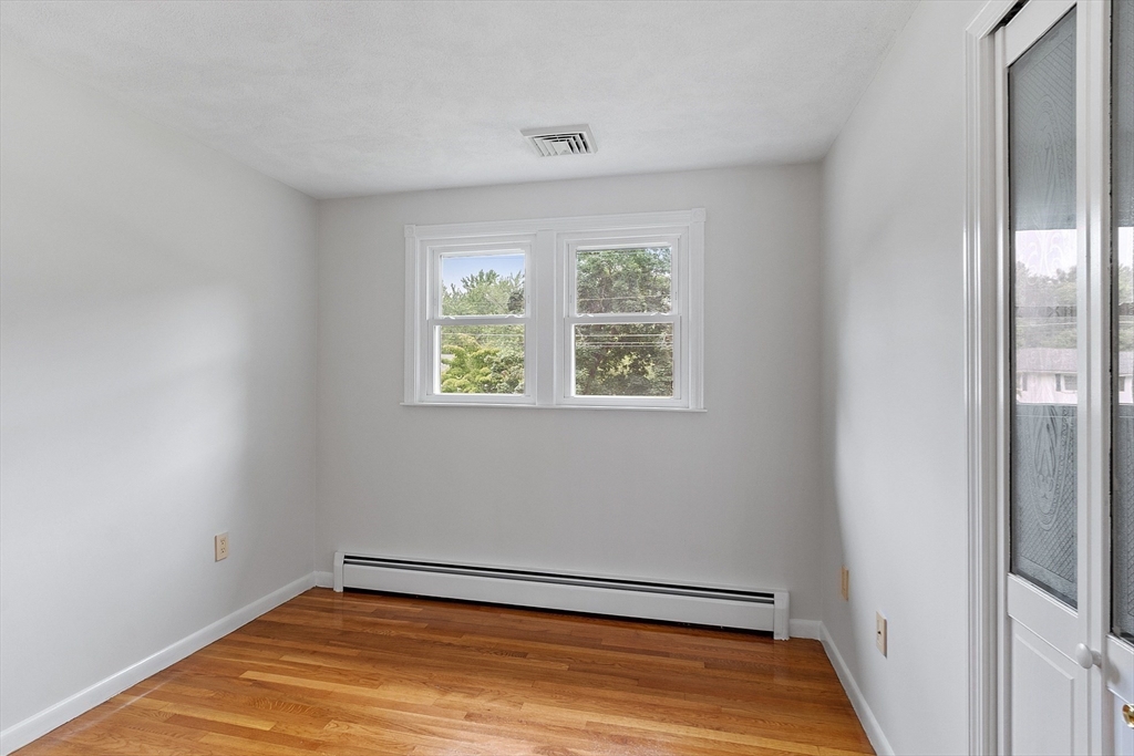 2 Johnson Road Chelmsford, MA 01824 - Photo 20 of 42 a view of room with window and wooden floor