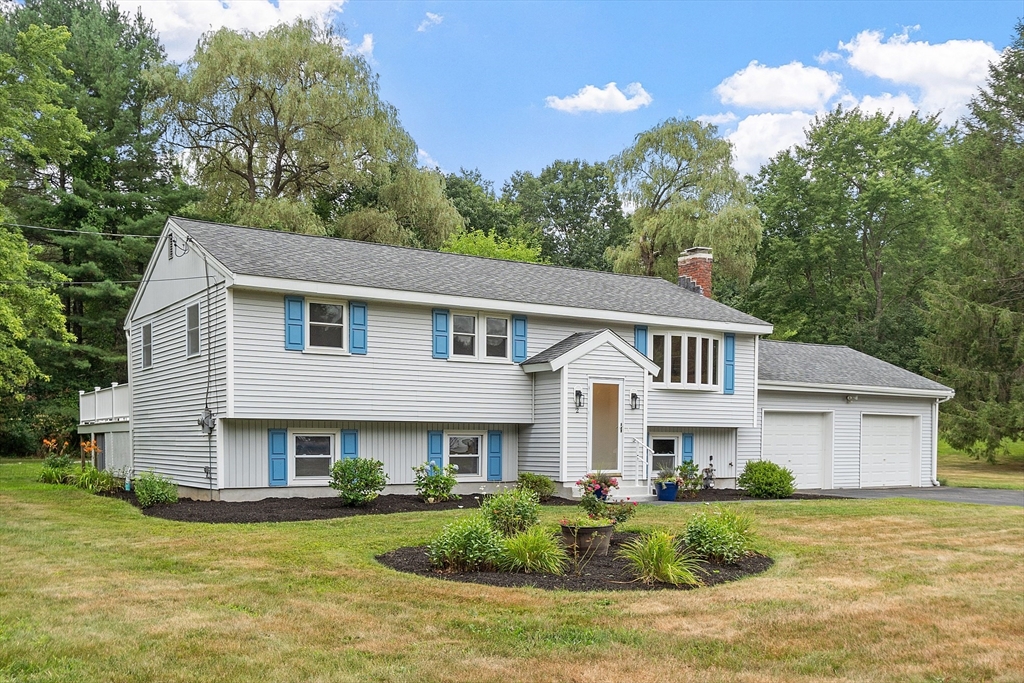 2 Johnson Road Chelmsford, MA 01824 - Photo 2 of 42 a front view of a house with a yard