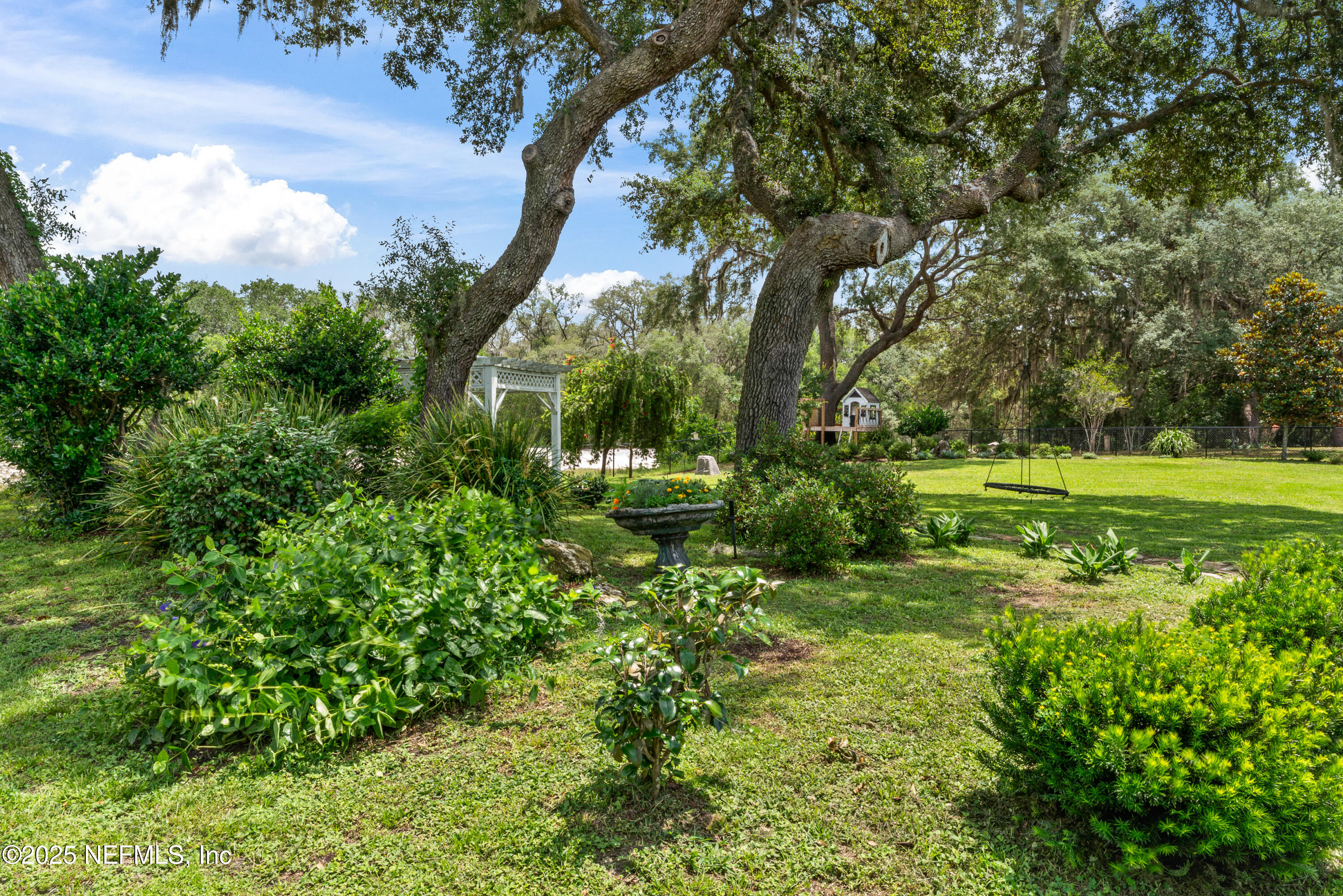6228 Blue Marlin Drive Keystone Heights, FL 32656 - Photo 14 of 45 a view of a garden with a tree