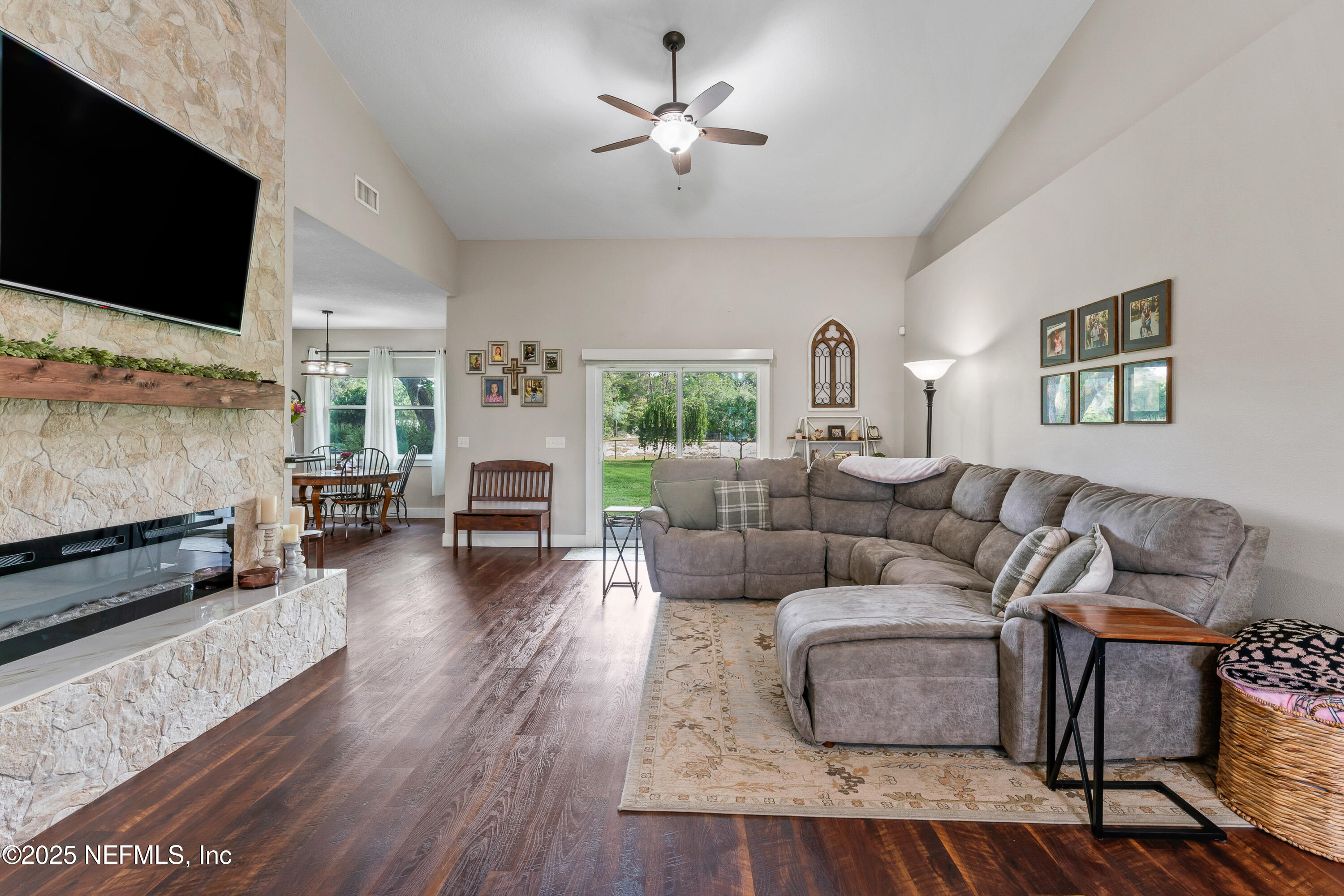 6228 Blue Marlin Drive Keystone Heights, FL 32656 - Photo 20 of 45 a living room with furniture and a flat screen tv