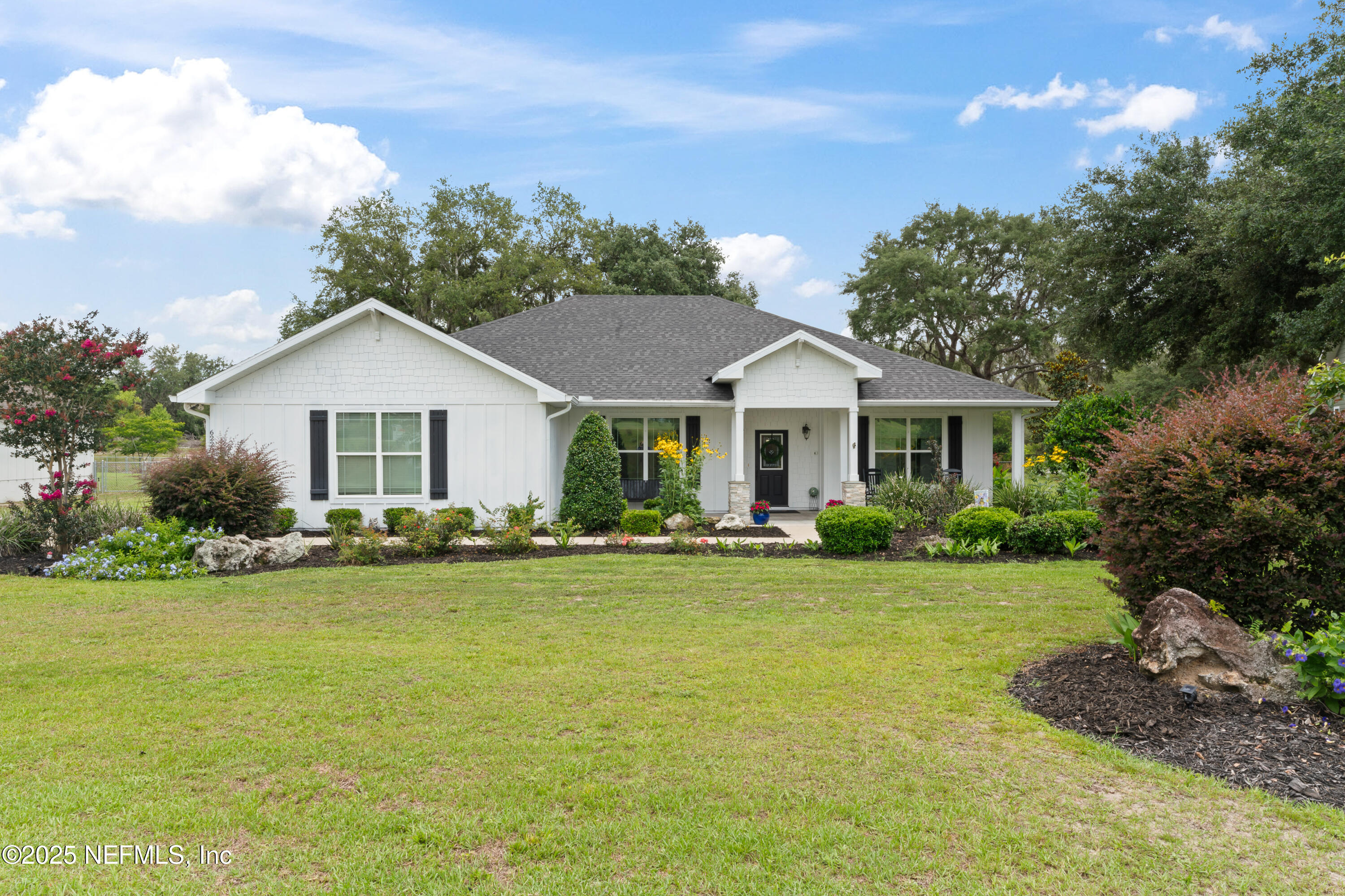 6228 Blue Marlin Drive Keystone Heights, FL 32656 - Photo 2 of 45 a front view of a house with garden and porch