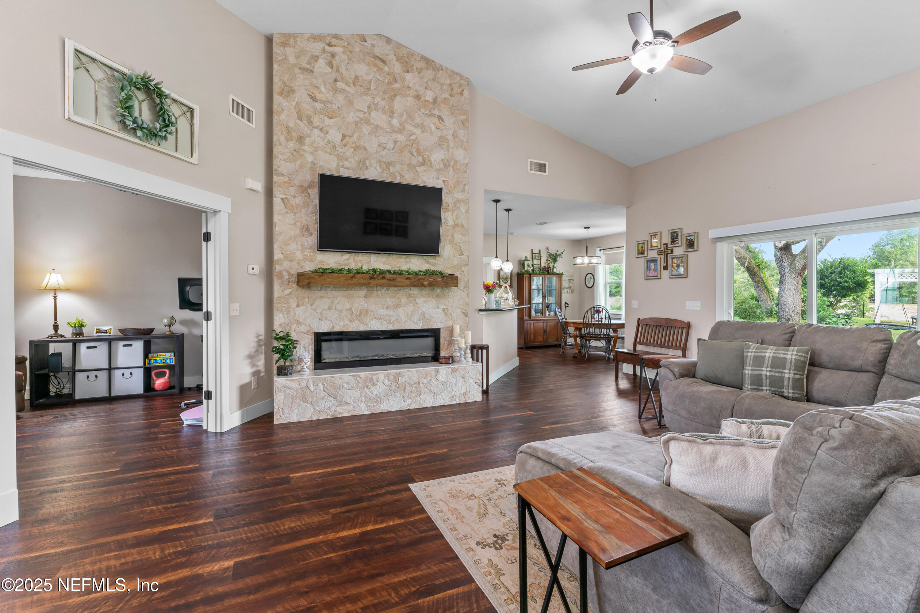6228 Blue Marlin Drive Keystone Heights, FL 32656 - Photo 22 of 45 a living room with furniture fireplace and flat screen tv