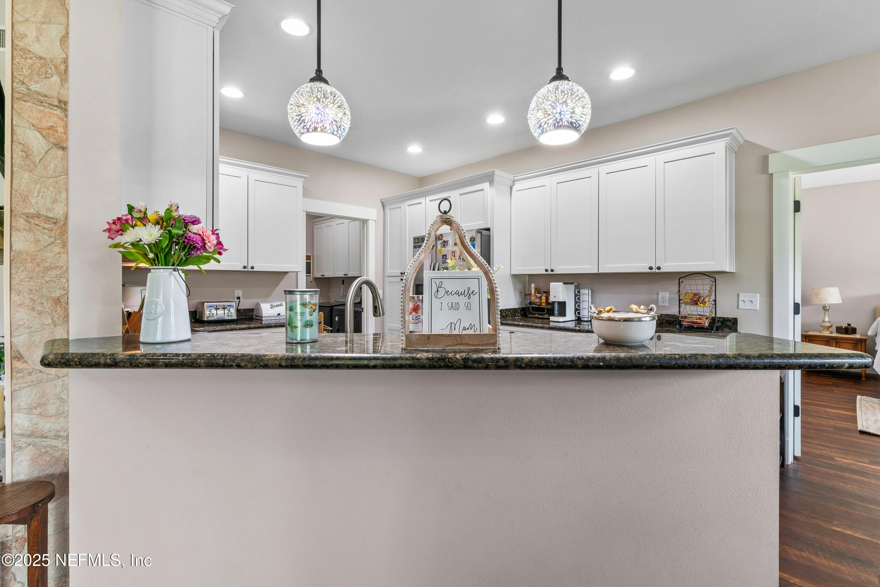 6228 Blue Marlin Drive Keystone Heights, FL 32656 - Photo 26 of 45 a kitchen with stainless steel appliances granite countertop a sink a stove top oven a clock and cabinets
