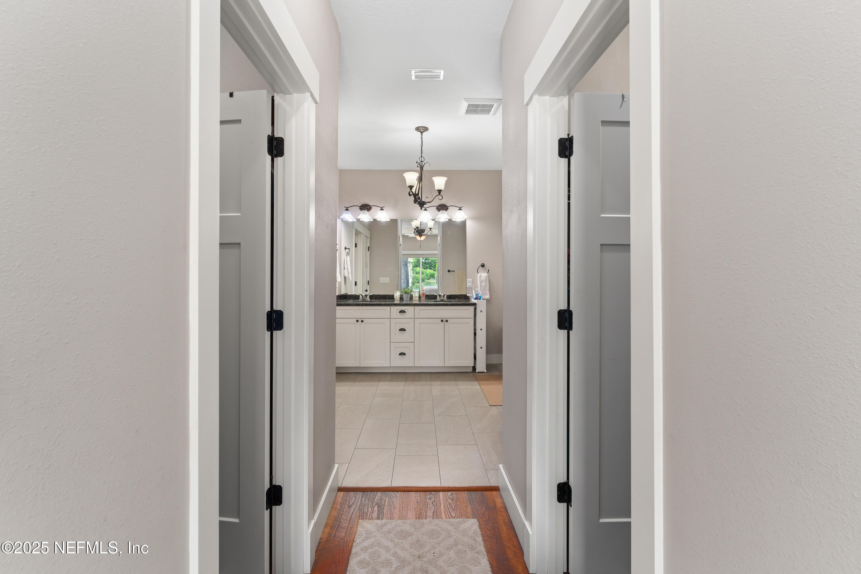 6228 Blue Marlin Drive Keystone Heights, FL 32656 - Photo 30 of 45 a view of a hallway with bathroom and mirror