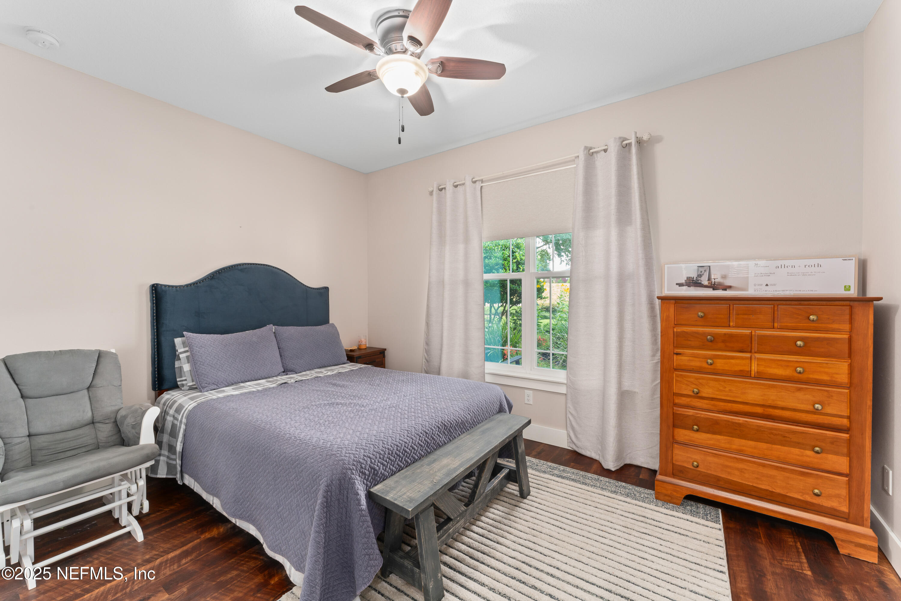 6228 Blue Marlin Drive Keystone Heights, FL 32656 - Photo 37 of 45 a bedroom with a bed and a chandelier