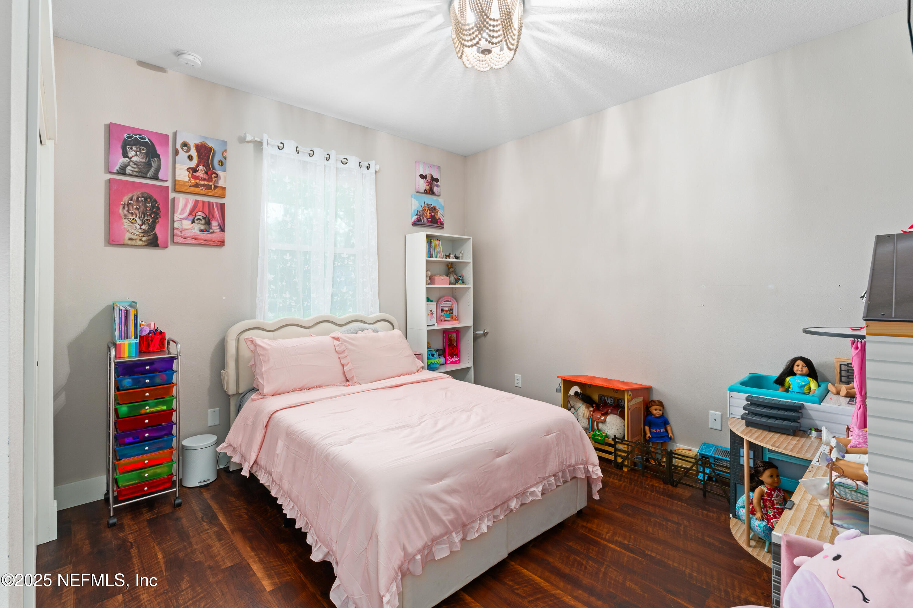 6228 Blue Marlin Drive Keystone Heights, FL 32656 - Photo 39 of 45 a bedroom with a bed and a wooden floor