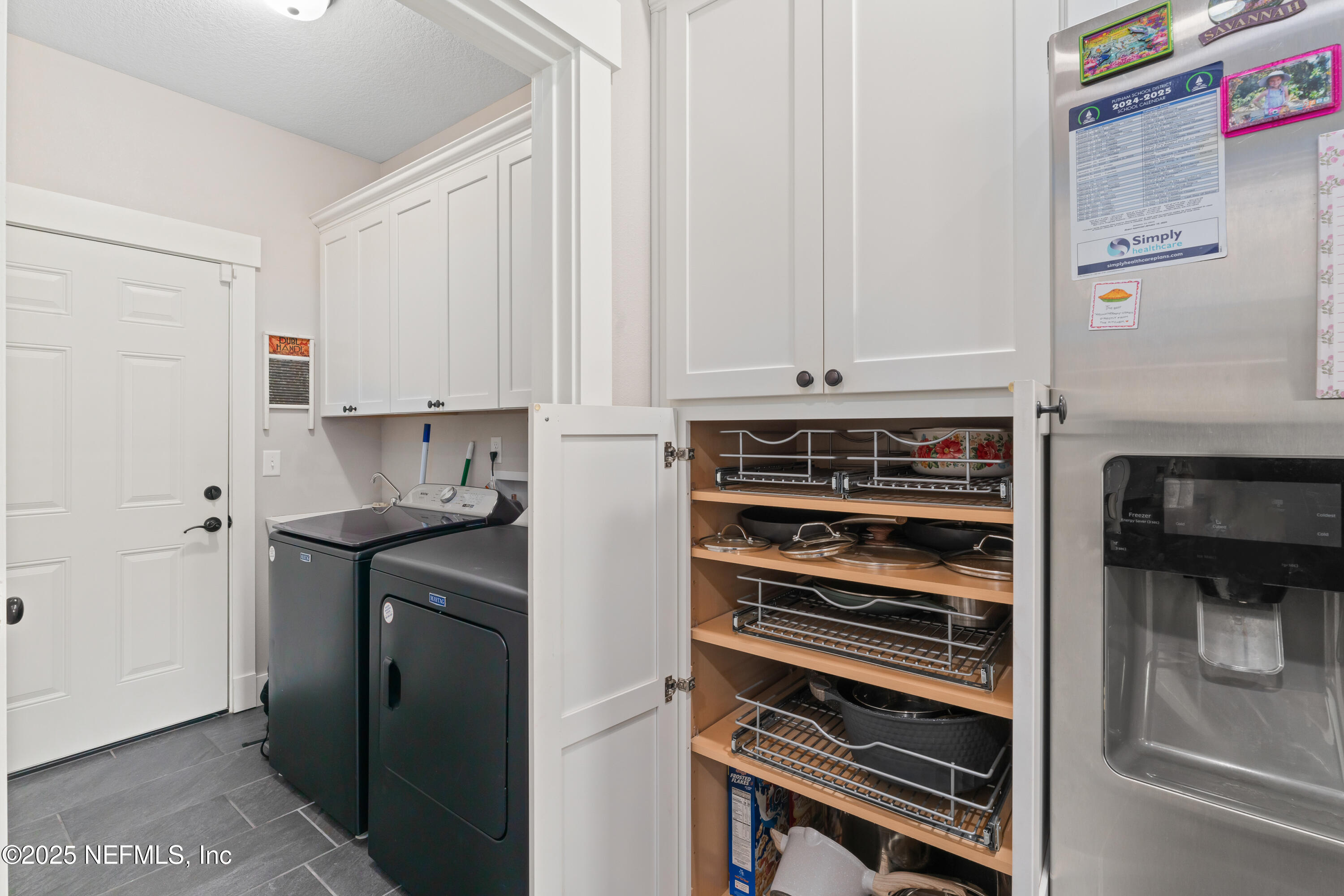 6228 Blue Marlin Drive Keystone Heights, FL 32656 - Photo 42 of 45 a kitchen with stainless steel appliances a stove and white cabinets