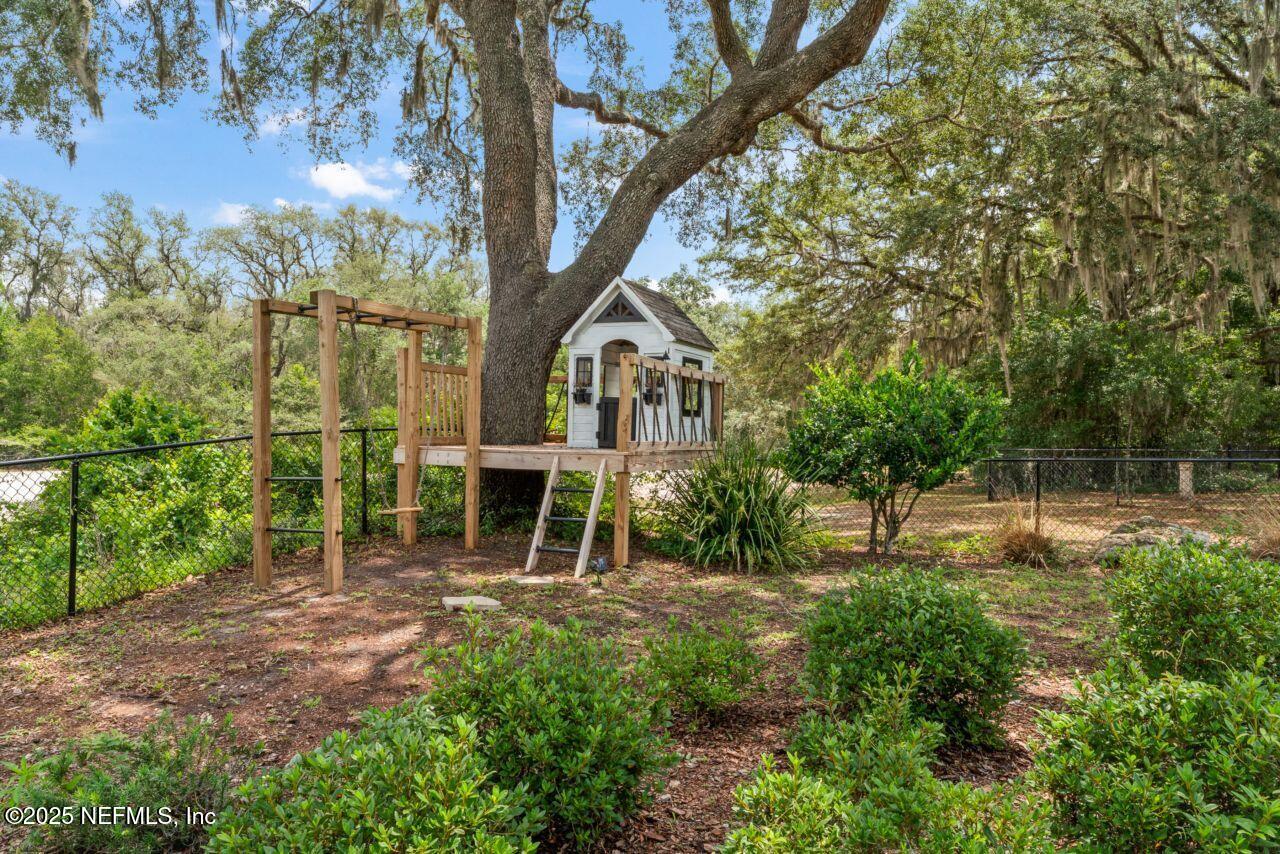 6228 Blue Marlin Drive Keystone Heights, FL 32656 - Photo 7 of 45 a backyard of a house with lots of green space