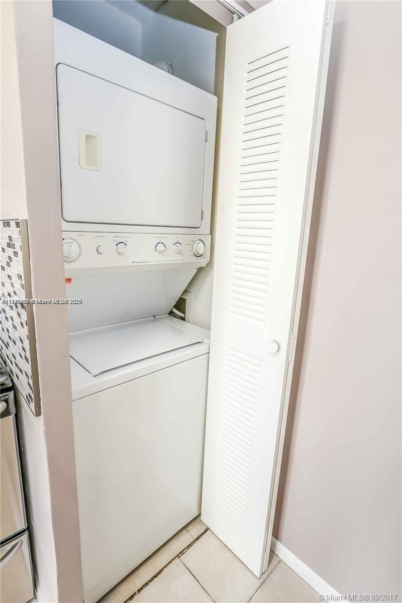 8734 Southwest 3rd Street, Unit 206 Pembroke Pines, FL 33025 - Photo 14 of 14 a utility room with dryer and washer