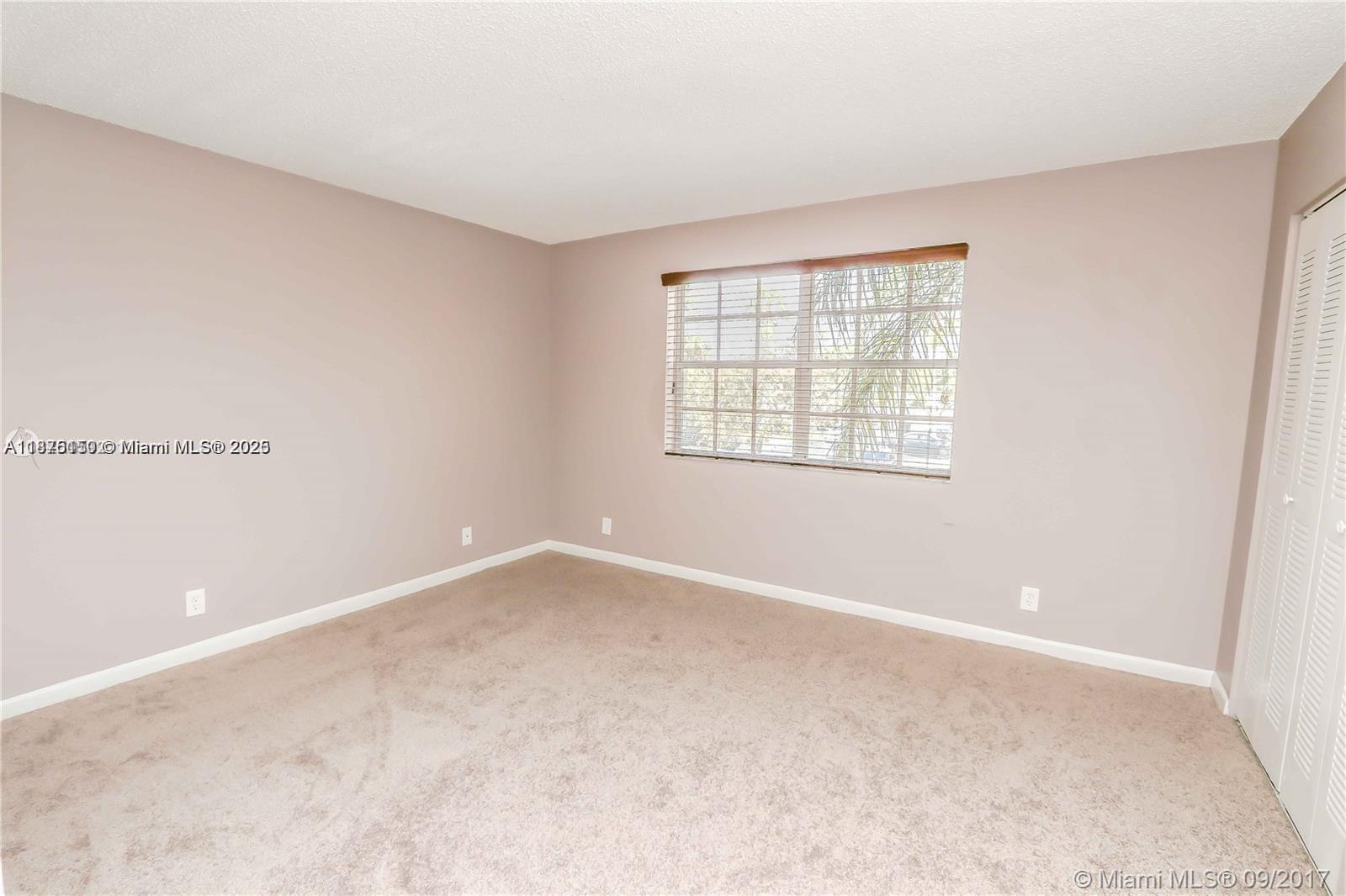 8734 Southwest 3rd Street, Unit 206 Pembroke Pines, FL 33025 - Photo 10 of 14 an empty room with a window