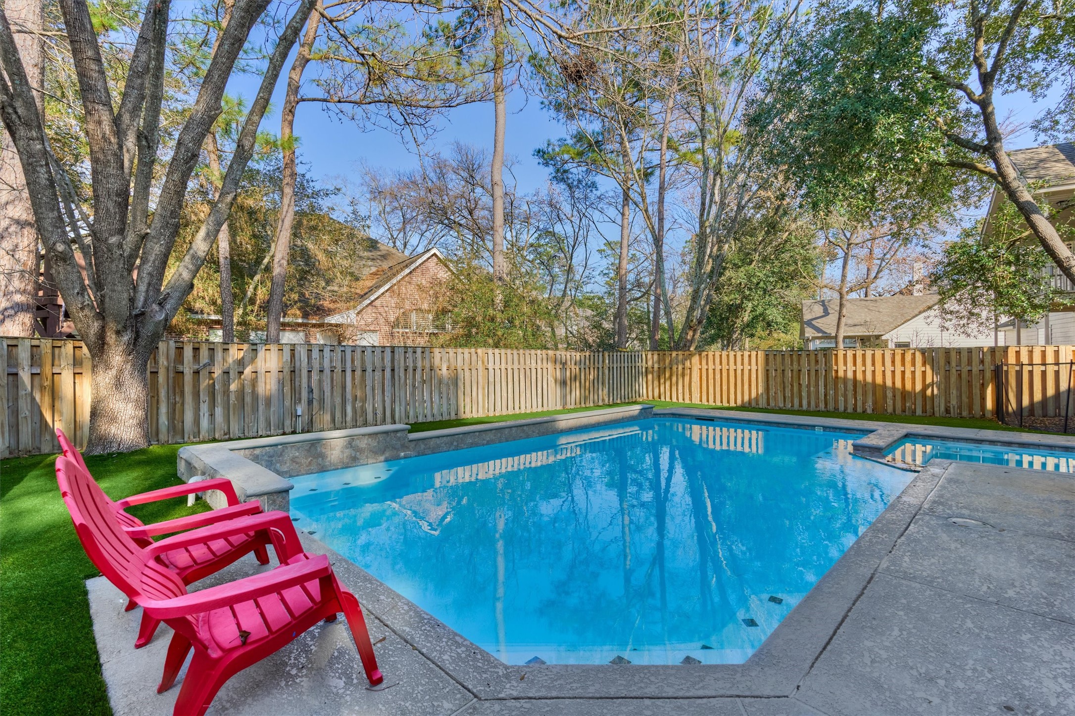 58 South Bethany Bend Circle Spring, TX 77382 - Photo 34 of 45 Relax poolside and enjoy your private backyard amidst the surrounds of nature.